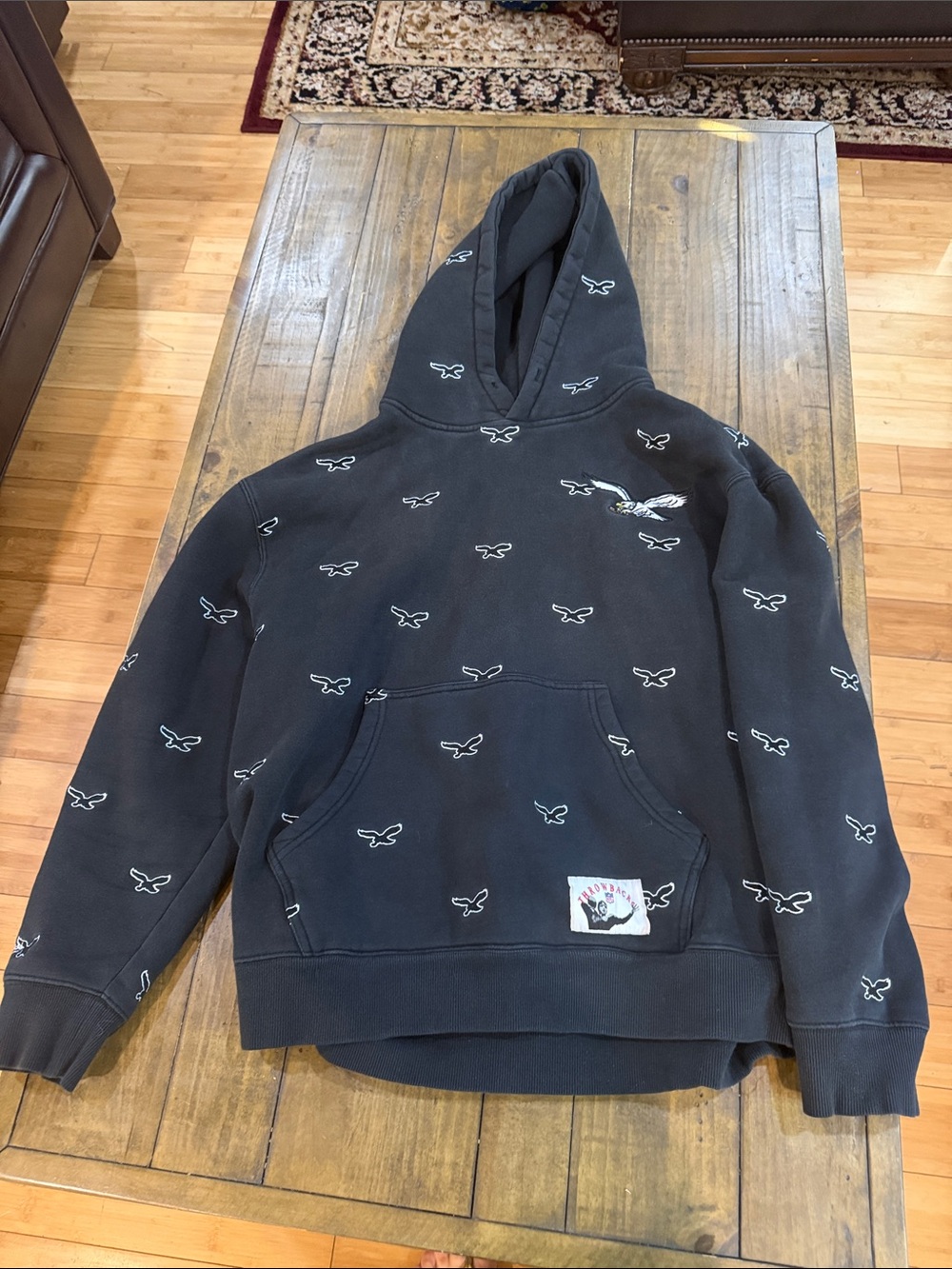 Mitchell and Ness Eagles Men's Black Hooded Sweatshirt with Eagles All-Over Logo